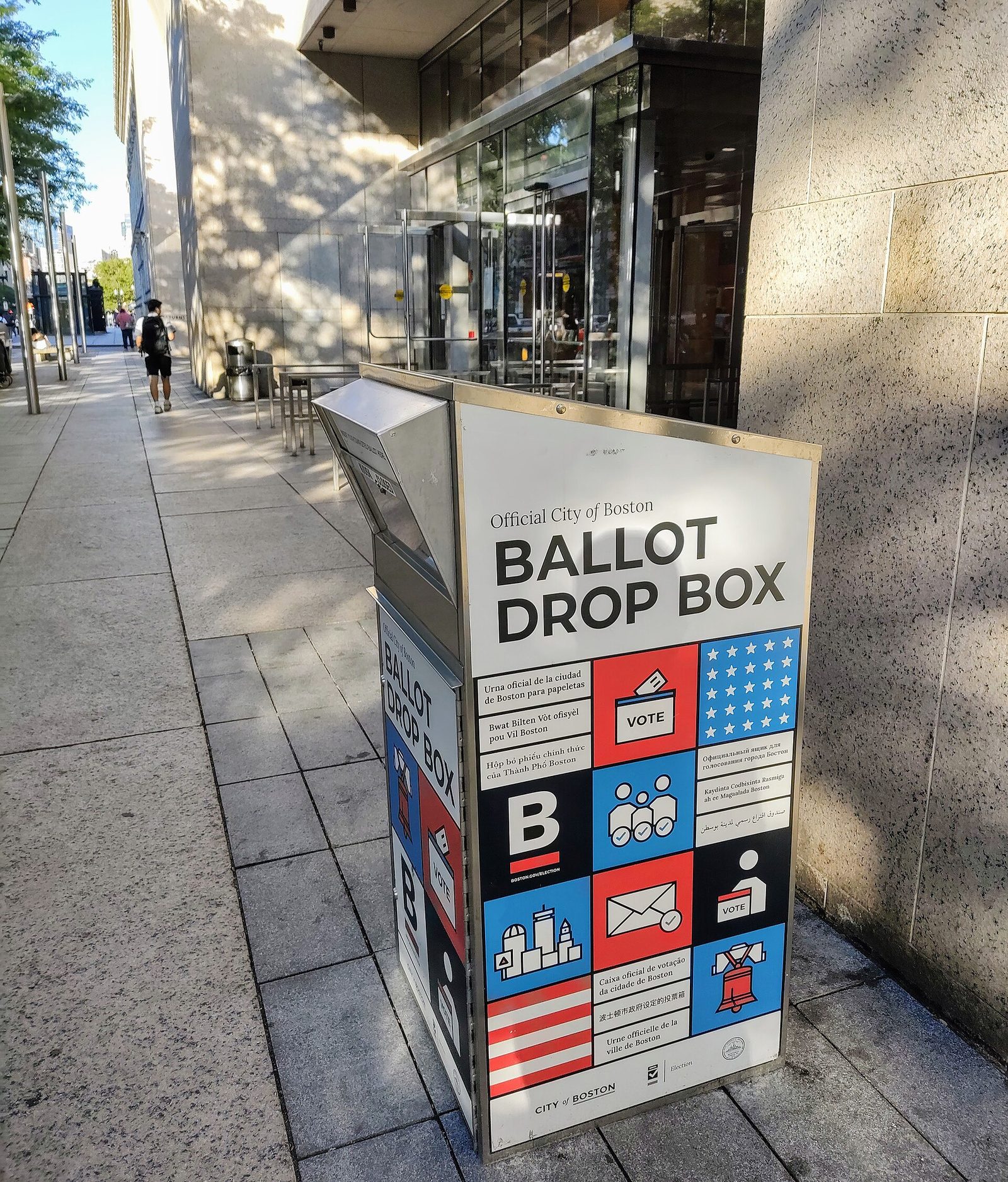 A red, white and blue ballot drop box in Boston