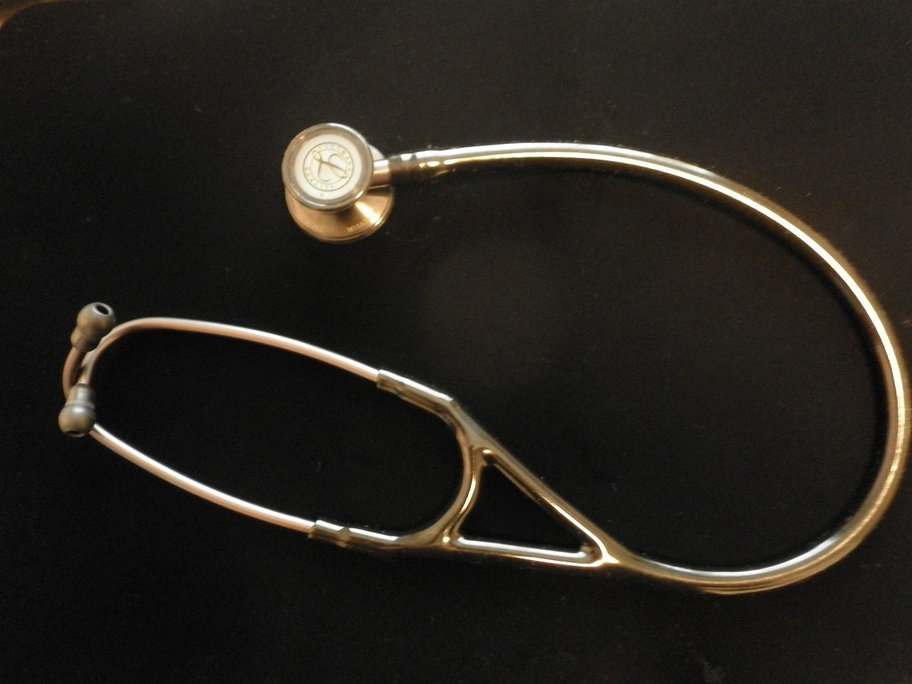 A stethoscope on a dark background